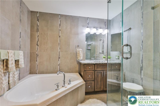 4691 Hampshire Dr, Hanover Twp, PA 18017 - bathroom with tile walls, vanity, a bath, and a shower stall
