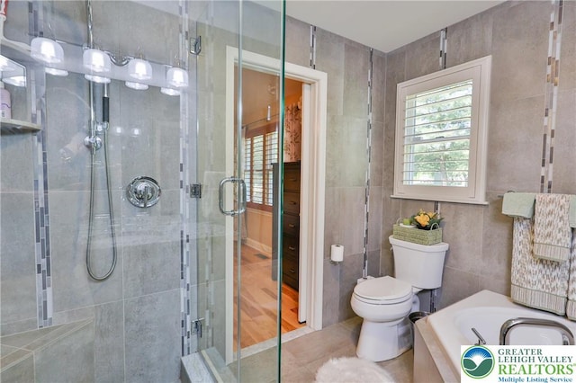 4691 Hampshire Dr, Hanover Twp, PA 18017 - full bath with a stall shower, a garden tub, and tile walls