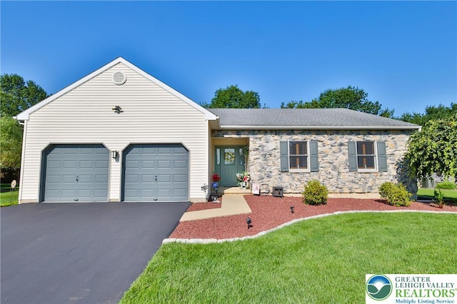 4691 Hampshire Dr, Hanover Twp, PA 18017 - view of front of property featuring driveway, an attached garage, a front yard, and stone siding