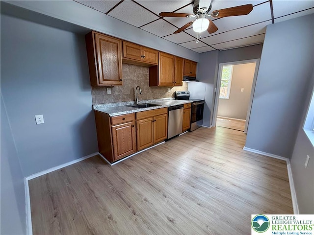 115 W Frankford St, Bethlehem City, PA 18018 - kitchen featuring appliances with stainless steel finishes, ceiling fan, light countertops, tasteful backsplash, and brown cabinetry