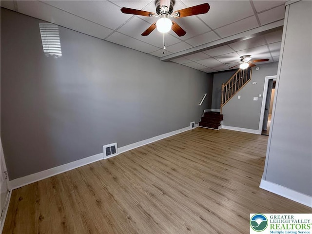 115 W Frankford St, Bethlehem City, PA 18018 - spare room featuring ceiling fan, a paneled ceiling, stairs, and wood finished floors