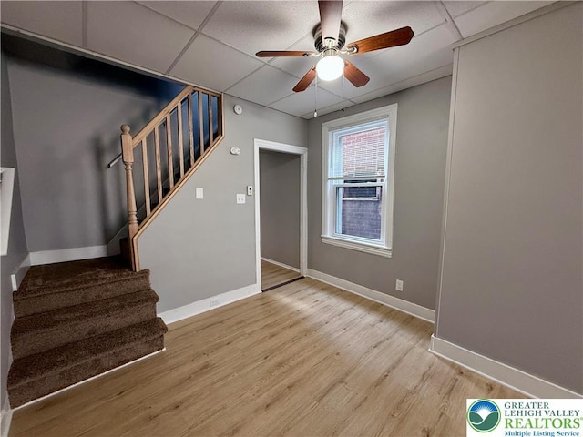 115 W Frankford St, Bethlehem City, PA 18018 - unfurnished living room with a ceiling fan, stairs, a paneled ceiling, and light wood finished floors