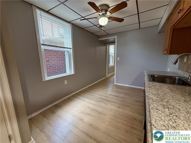 115 W Frankford St, Bethlehem City, PA 18018 - kitchen with a ceiling fan, a paneled ceiling, healthy amount of natural light, light wood finished floors, and brown cabinets