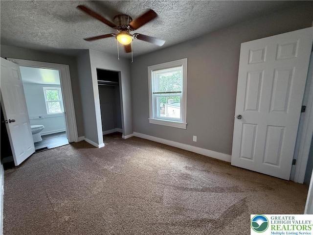 115 W Frankford St, Bethlehem City, PA 18018 - unfurnished bedroom featuring multiple windows, carpet flooring, a closet, a textured ceiling, and a ceiling fan