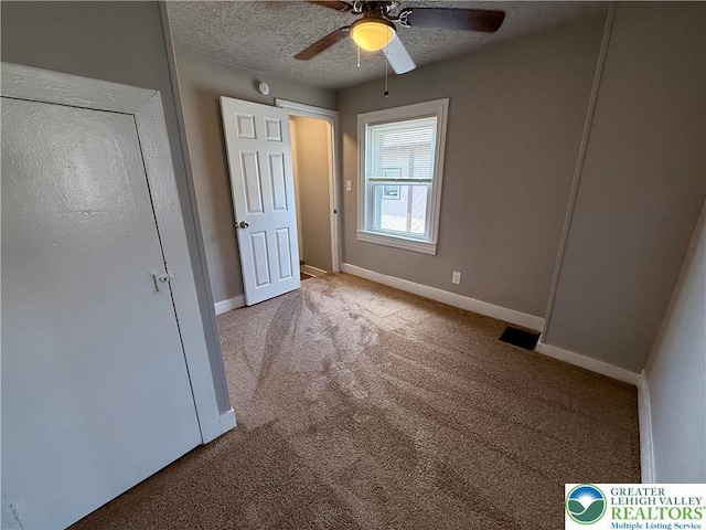 115 W Frankford St, Bethlehem City, PA 18018 - unfurnished bedroom with carpet, a textured ceiling, and a ceiling fan