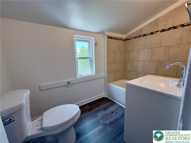 115 W Frankford St, Bethlehem City, PA 18018 - full bathroom featuring wood finished floors, a tub, vanity, lofted ceiling, and crown molding