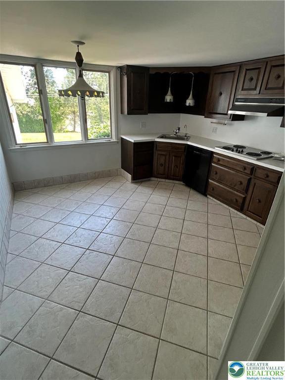 4941 Glenview St, North Whitehall Twp, PA 18078 - kitchen featuring black dishwasher, stovetop, light tile patterned floors, and light countertops