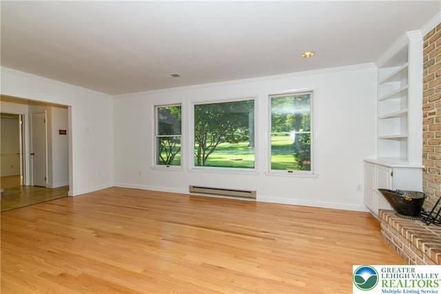 4015 Sycamore Dr, Lehigh Twp, PA 18067 - unfurnished living room with a baseboard heating unit, light wood-style floors, built in shelves, and crown molding
