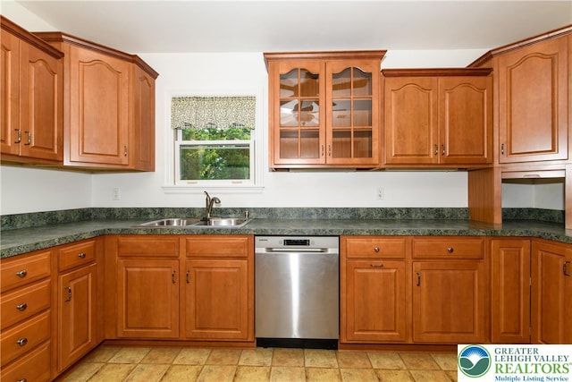 4015 Sycamore Dr, Lehigh Twp, PA 18067 - kitchen with stainless steel dishwasher, dark countertops, glass insert cabinets, and brown cabinetry
