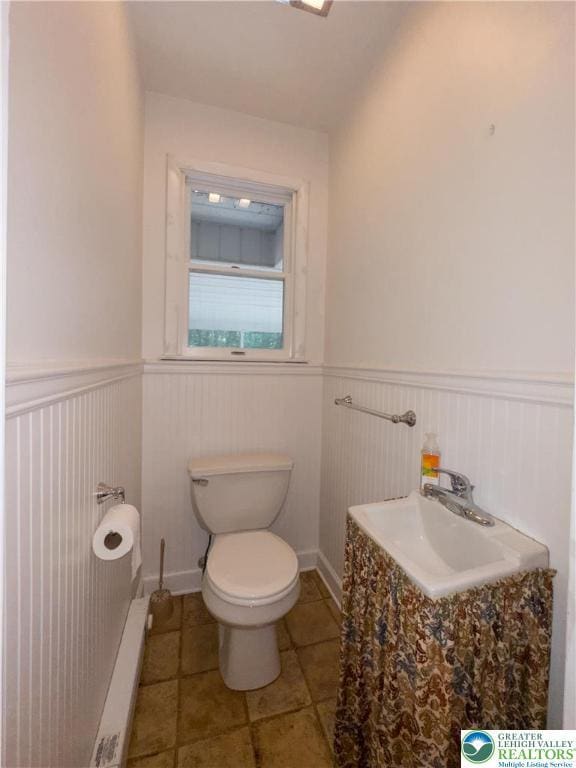 4015 Sycamore Dr, Lehigh Twp, PA 18067 - bathroom with a wainscoted wall and tile patterned floors