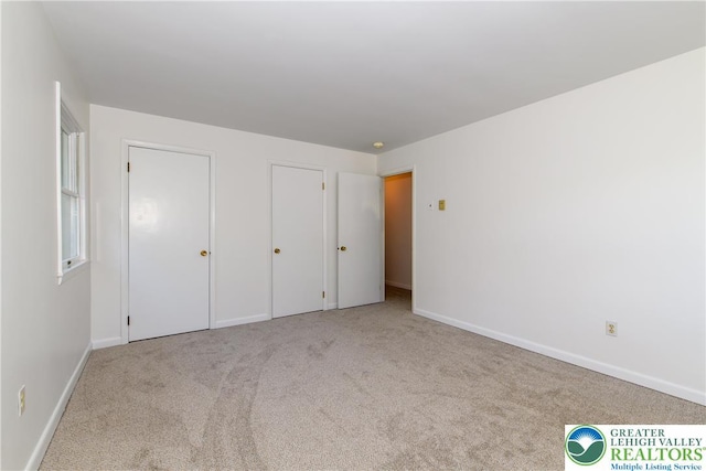 4015 Sycamore Dr, Lehigh Twp, PA 18067 - unfurnished bedroom featuring carpet floors and multiple closets