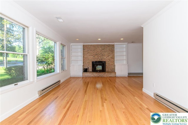 4015 Sycamore Dr, Lehigh Twp, PA 18067 - unfurnished living room with baseboard heating, light wood-type flooring, built in features, ornamental molding, and recessed lighting