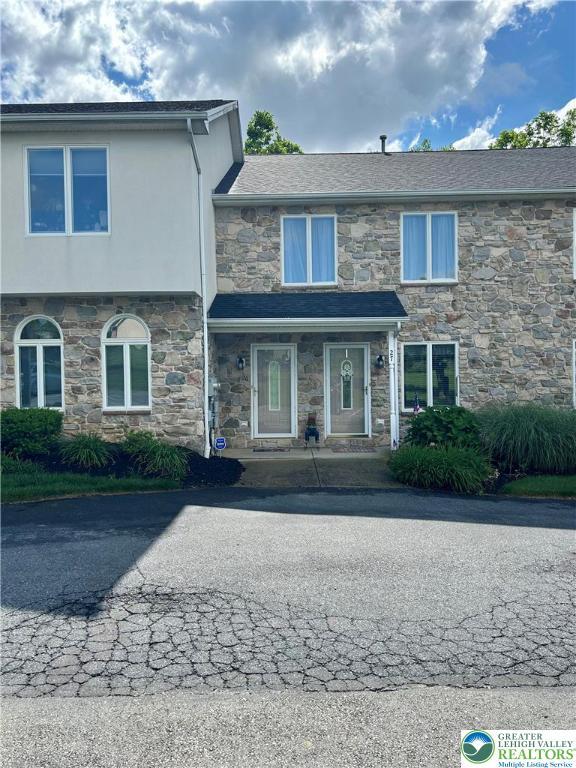 26 Chestnut Commons Ct, Easton, PA 18040 - view of property featuring stone siding and stucco siding