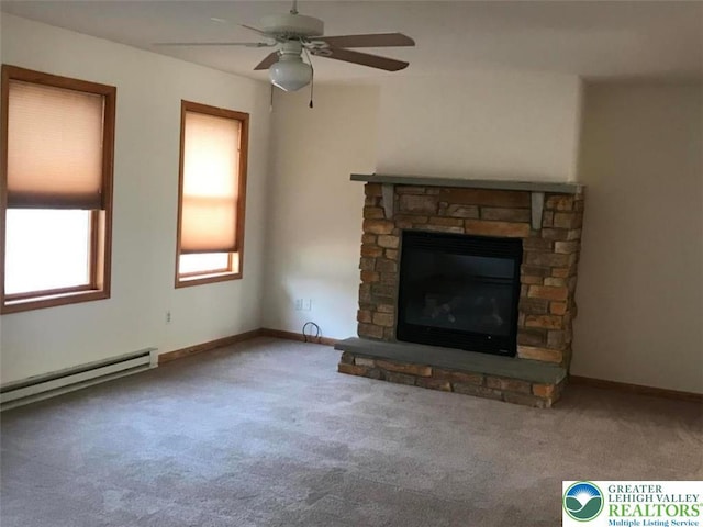 217 St Andrews Dr, Middle Smithfield Twp, PA 18324 - unfurnished living room featuring a baseboard radiator, carpet flooring, a ceiling fan, and a fireplace