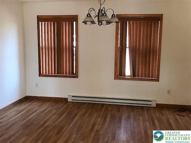217 St Andrews Dr, Middle Smithfield Twp, PA 18324 - empty room featuring baseboard heating, a chandelier, and wood finished floors