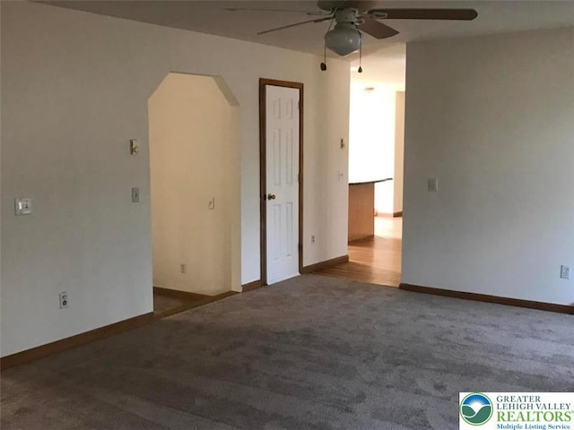 217 St Andrews Dr, Middle Smithfield Twp, PA 18324 - empty room with ceiling fan, arched walkways, and carpet