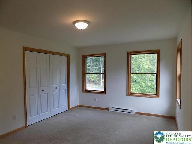 217 St Andrews Dr, Middle Smithfield Twp, PA 18324 - unfurnished bedroom with baseboard heating, carpet floors, and a closet