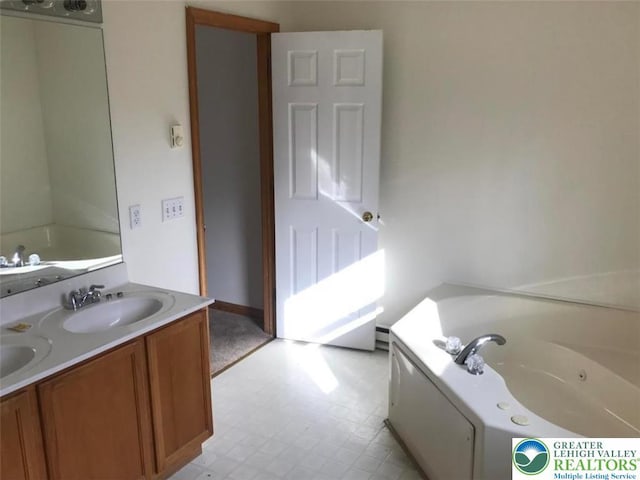 217 St Andrews Dr, Middle Smithfield Twp, PA 18324 - bathroom with a whirlpool tub, double vanity, and tile patterned floors