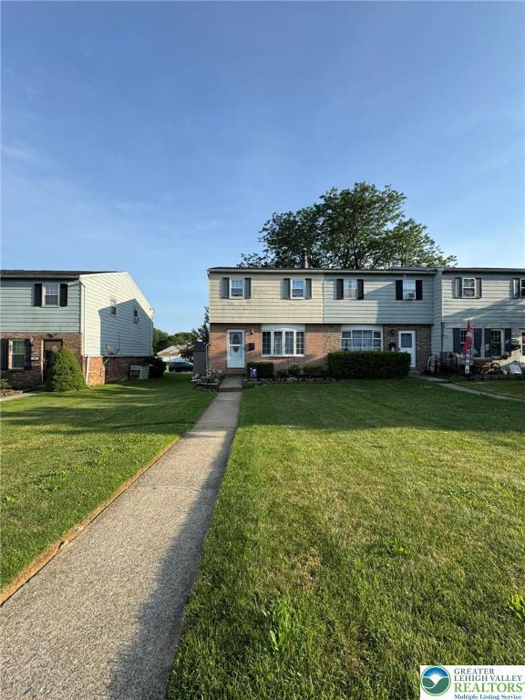 7 Madison Ln, Whitehall Twp, PA 18052 - townhome / multi-family property featuring a front lawn