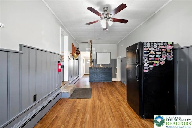320 Nulton Ave, Palmer Twp, PA 18045 - kitchen featuring freestanding refrigerator, a baseboard radiator, ornamental molding, ceiling fan, and light wood-style flooring