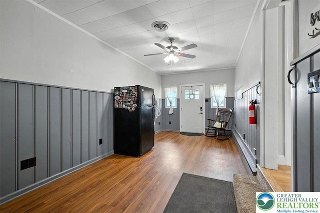 320 Nulton Ave, Palmer Twp, PA 18045 - entryway with wood finished floors, ceiling fan, crown molding, and a wainscoted wall