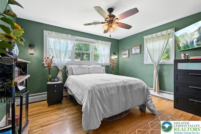 320 Nulton Ave, Palmer Twp, PA 18045 - bedroom with a baseboard heating unit, light wood finished floors, and a ceiling fan