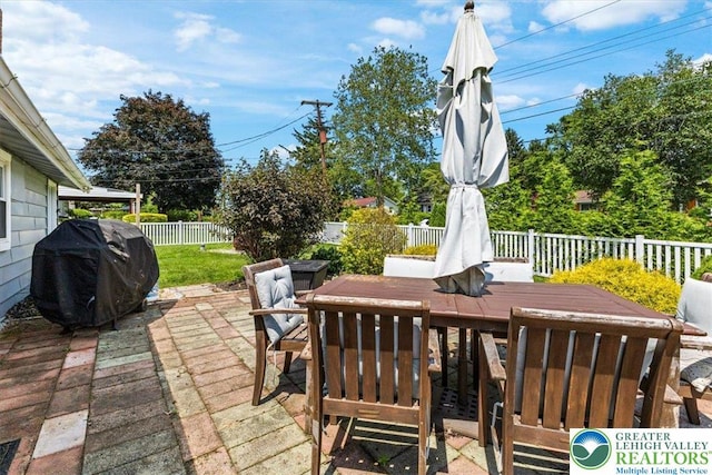 320 Nulton Ave, Palmer Twp, PA 18045 - wooden deck featuring outdoor dining area, a grill, a fenced backyard, and a patio