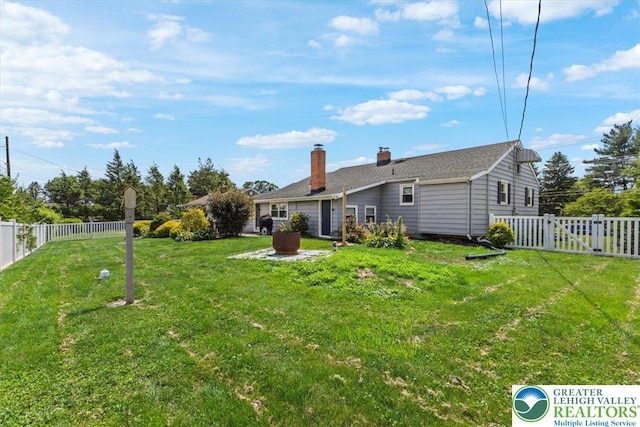 320 Nulton Ave, Palmer Twp, PA 18045 - back of property with a chimney and a fenced backyard