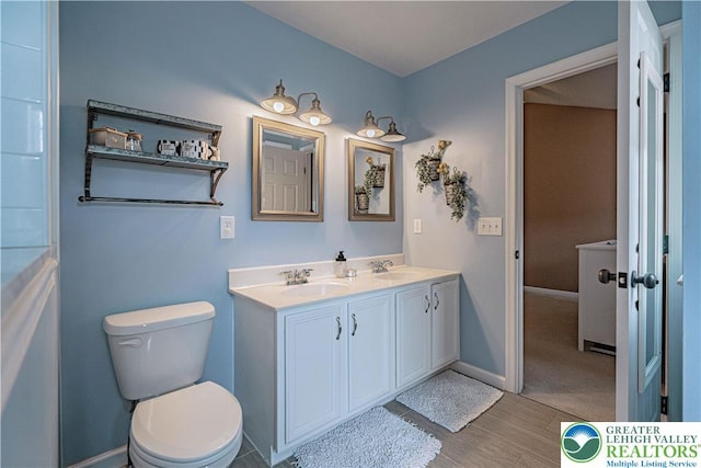 301 Maple Ct, Alburtis Boro, PA 18011 - bathroom with double vanity and wood finished floors
