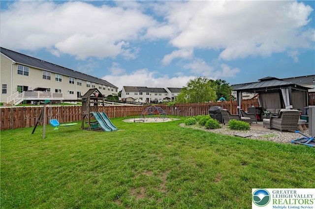 301 Maple Ct, Alburtis Boro, PA 18011 - fenced backyard with a gazebo, a playground, an outdoor hangout area, a patio area, and a residential view