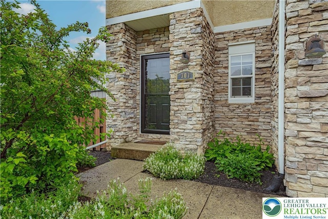 301 Maple Ct, Alburtis Boro, PA 18011 - doorway to property featuring stone siding and stucco siding