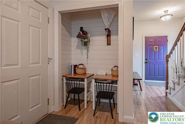 301 Maple Ct, Alburtis Boro, PA 18011 - foyer entrance featuring stairway, light wood-style flooring, and wooden walls