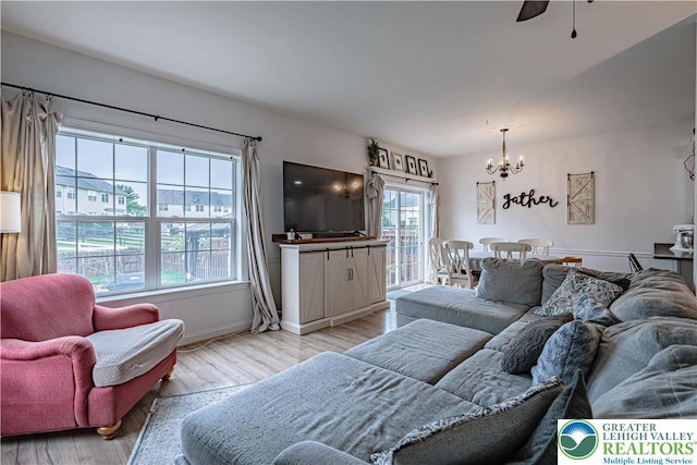 301 Maple Ct, Alburtis Boro, PA 18011 - living room with a chandelier, light wood-type flooring, and a ceiling fan