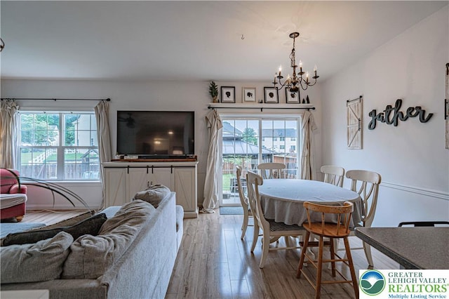 301 Maple Ct, Alburtis Boro, PA 18011 - dining space with a chandelier, healthy amount of natural light, and light wood-style floors