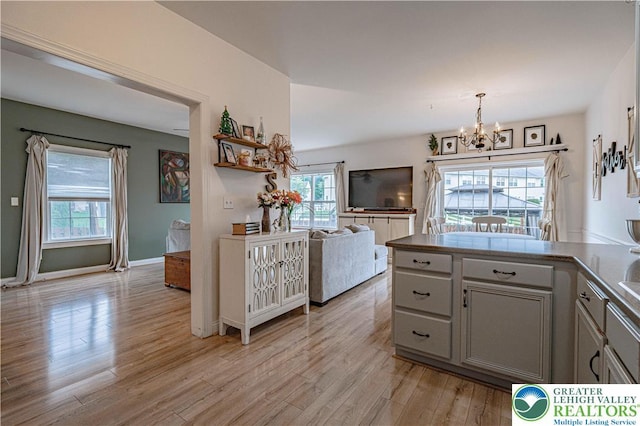 301 Maple Ct, Alburtis Boro, PA 18011 - kitchen featuring a chandelier, light wood-type flooring, and healthy amount of natural light