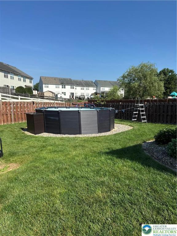 301 Maple Ct, Alburtis Boro, PA 18011 - fenced backyard featuring a residential view