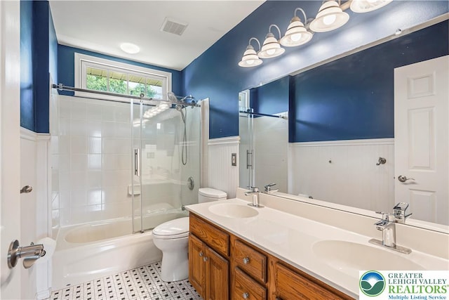 2535 Clark Pl, Forks Twp, PA 18040 - bathroom with a wainscoted wall, double vanity, and shower / bath combination with glass door