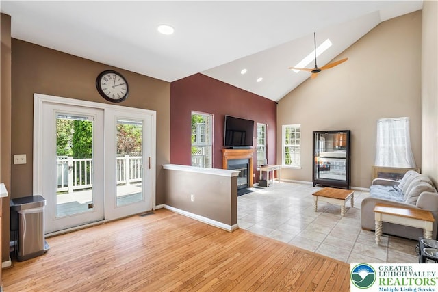 2535 Clark Pl, Forks Twp, PA 18040 - living room featuring wood finished floors, a glass covered fireplace, recessed lighting, high vaulted ceiling, and ceiling fan