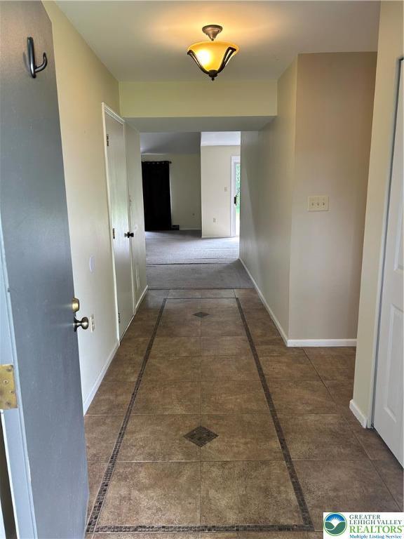 349 Tamarack Dr, South Whitehall Twp, PA 18104 - corridor with inlaid floor details and baseboards