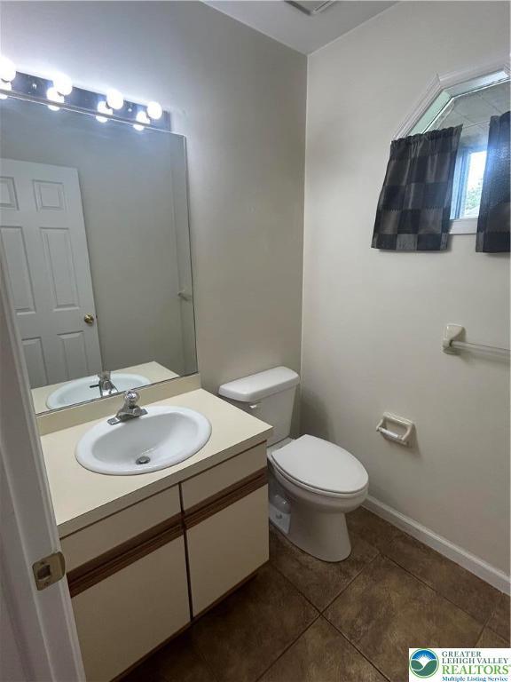 349 Tamarack Dr, South Whitehall Twp, PA 18104 - half bathroom with tile patterned floors and vanity