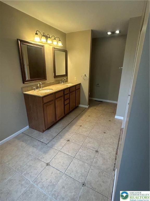 349 Tamarack Dr, South Whitehall Twp, PA 18104 - bathroom featuring double vanity and tile patterned flooring