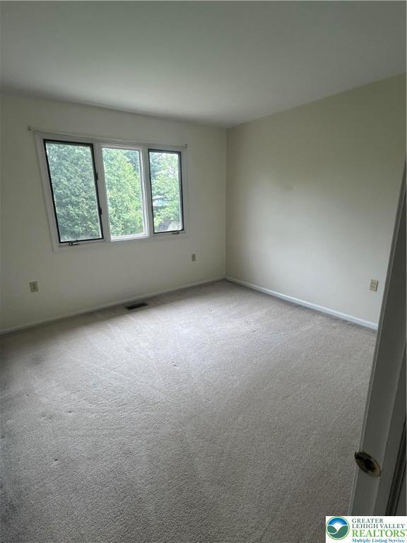 349 Tamarack Dr, South Whitehall Twp, PA 18104 - carpeted empty room featuring baseboards