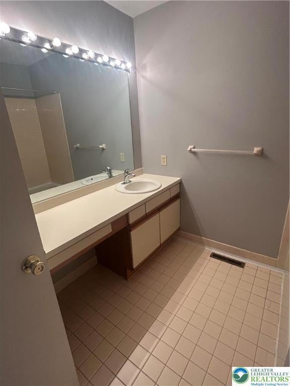 349 Tamarack Dr, South Whitehall Twp, PA 18104 - full bath with tile patterned flooring, vanity, and a shower