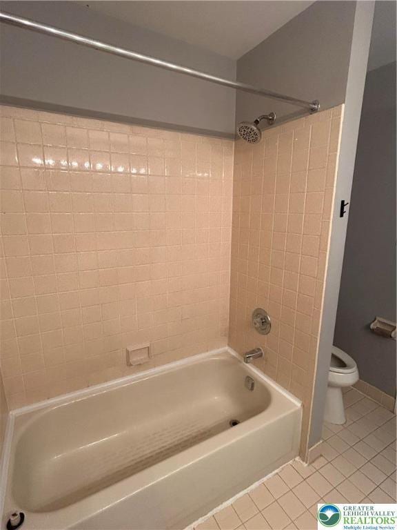 349 Tamarack Dr, South Whitehall Twp, PA 18104 - bathroom with tile patterned floors and washtub / shower combination