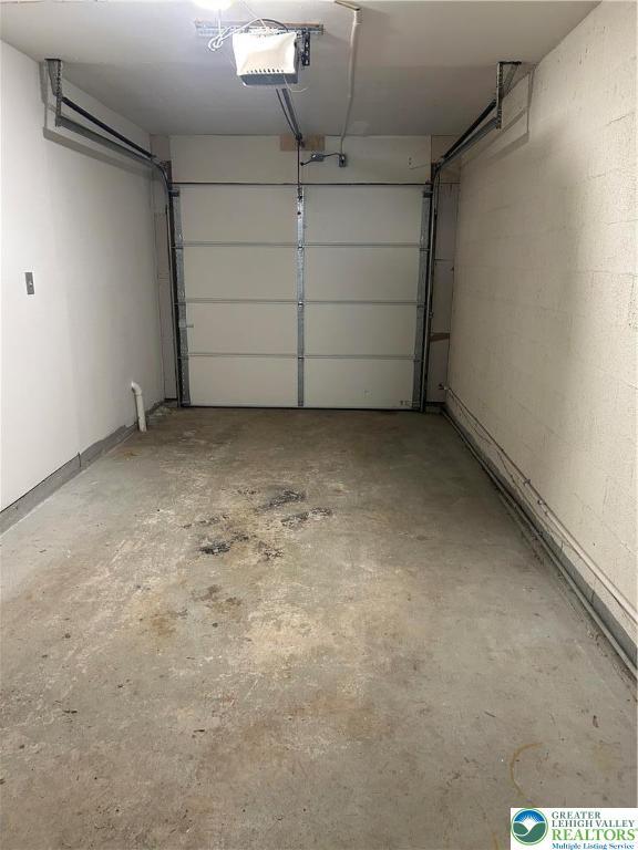 349 Tamarack Dr, South Whitehall Twp, PA 18104 - garage featuring a garage door opener