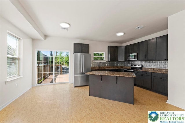 271 W Fairview St W, Bethlehem City, PA 18018 - kitchen featuring stainless steel appliances, a center island, decorative backsplash, and plenty of natural light