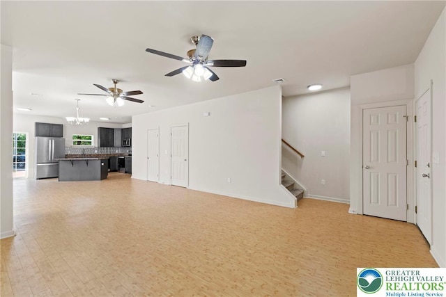 271 W Fairview St W, Bethlehem City, PA 18018 - unfurnished living room with a chandelier, stairs, ceiling fan, and light wood-style floors