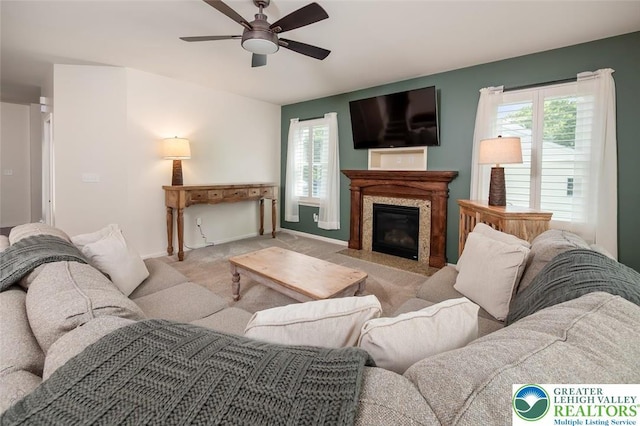 2186 Eagles Landing Dr, Upper Nazareth Twp, PA 18064 - living area featuring plenty of natural light, ceiling fan, carpet flooring, and a fireplace