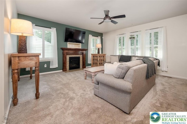 2186 Eagles Landing Dr, Upper Nazareth Twp, PA 18064 - living area with ceiling fan, carpet, and a fireplace with flush hearth