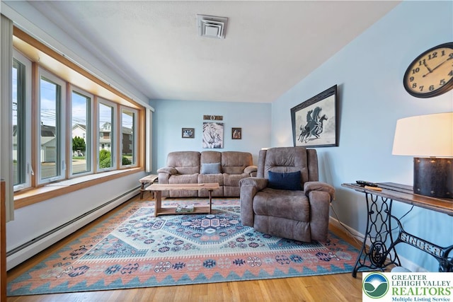 275 E Thomas Ave, Hellertown Boro, PA 18055 - living area with a baseboard radiator and wood finished floors